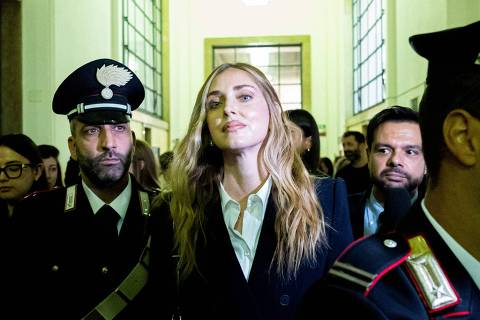 (FILES) Italian influencer and businesswoman Chiara Ferragni, charged for aggravated fraud in a case linked to a Pandoro charity initiative, leaves the courthouse of Milan after a preliminary hearing, in Milan on November 4, 2025. In the hearing on November 25, 2025 prosecutors are expected to make their request for the sentence they think she should receive if found guilty. The 38-year-old, who is based in Milan, denies the allegations and insists she always acted in good faith. (Photo by Piero CRUCIATTI / AFP)